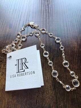 Lisa Robertson bezel-set crystal necklace in gold tone.